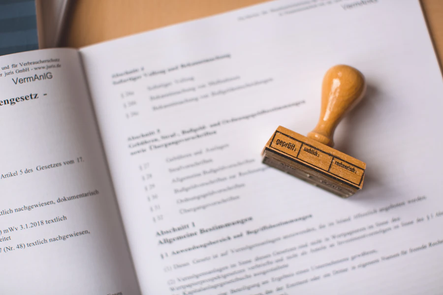 A rubber stamp resting on a legal document